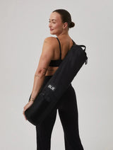 The OLIE BLACK YOGA MAT BAG. Made From 100% Recycled Materials. An Enhanced Take On The Classic Yoga Mat Bag.