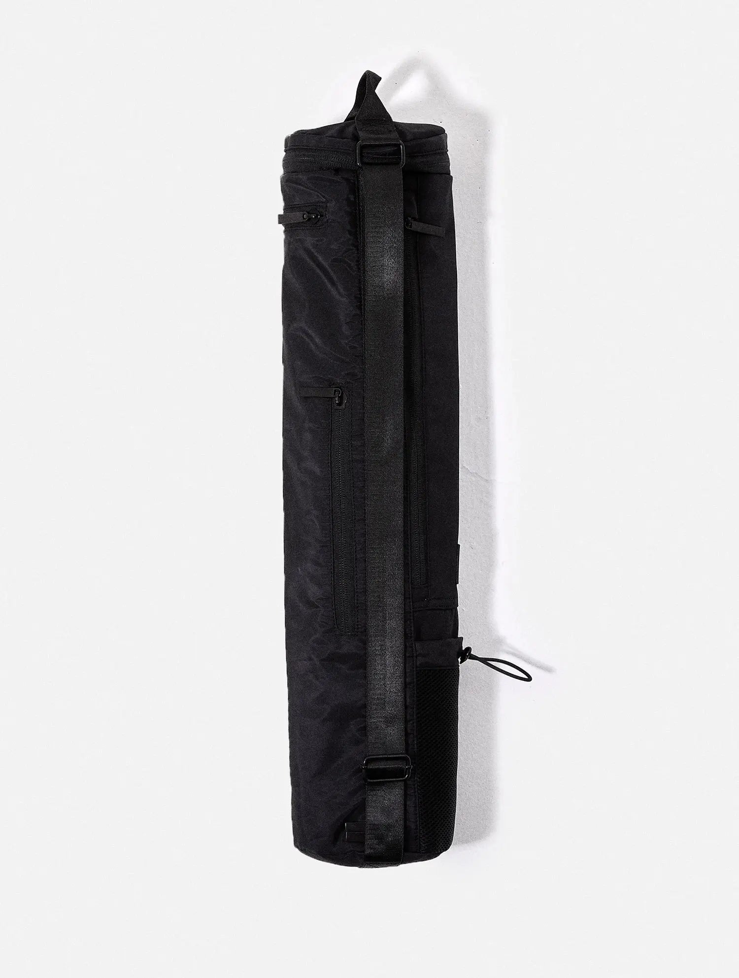 The OLIE BLACK YOGA MAT BAG. Made From 100% Recycled Materials. An Enhanced Take On The Classic Yoga Mat Bag.