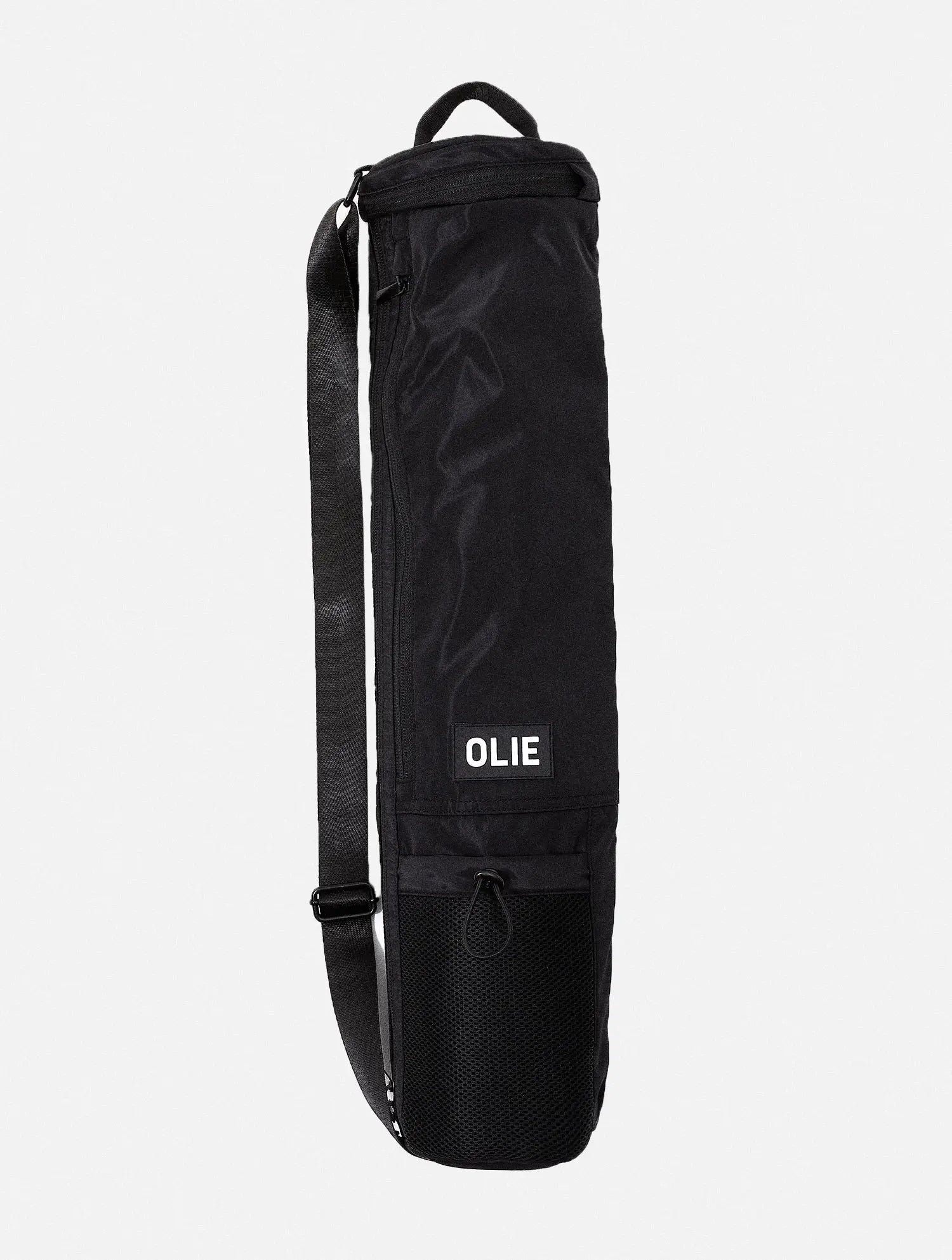 The OLIE BLACK YOGA MAT BAG. Made From 100% Recycled Materials. An Enhanced Take On The Classic Yoga Mat Bag.