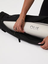 The OLIE BLACK YOGA MAT BAG. Made From 100% Recycled Materials. An Enhanced Take On The Classic Yoga Mat Bag.